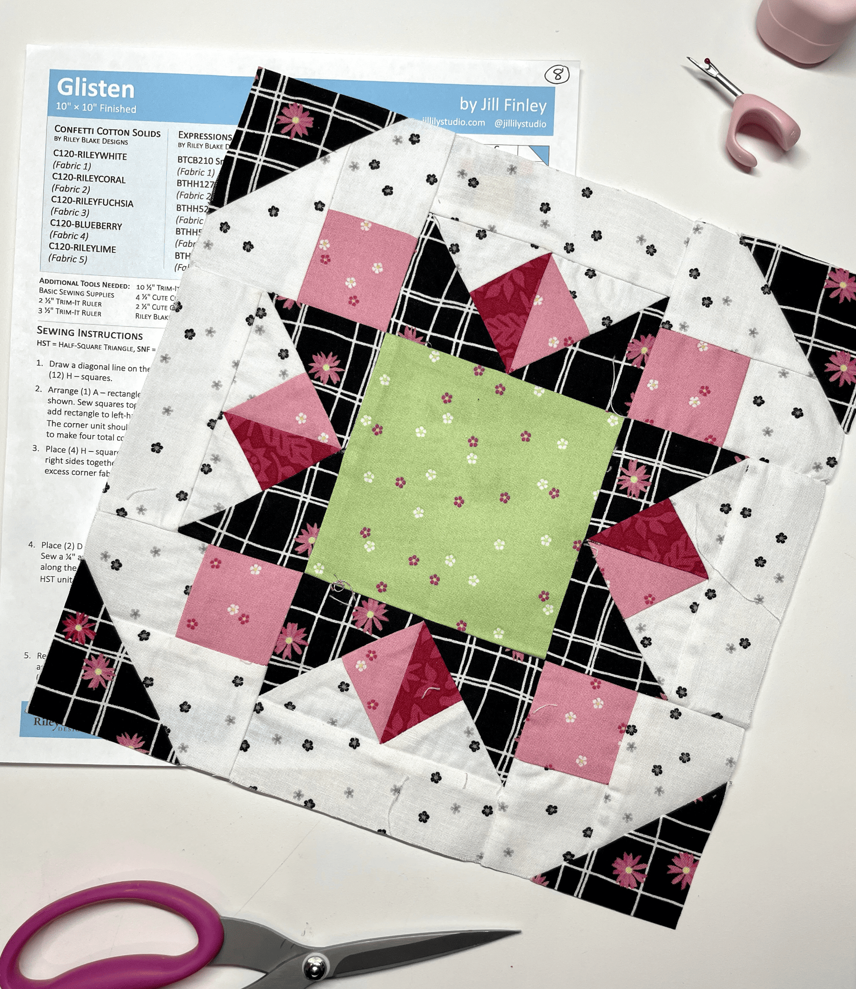 Green, black, red and white quilt block